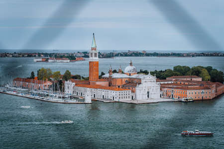 Chiesa di San Giorgio Maggiore or San Giorgio Maggiore island from St. Marks Campanile bell tower of Venice, Italyの写真素材