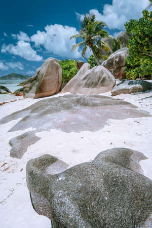 Tropical beach with granite boulders at Seychelles. Travel, Exotic tourism and nature concept backgroundの写真素材