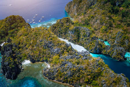 Aerial drone of entrance to big lagoon with limestone cliffs and blue water. Miniloc island, Marine National Reserve in El Nido, Palawan, Philippinesの写真素材