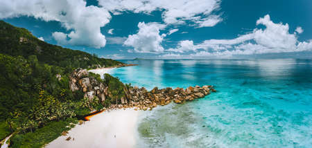 Aerial panoramic view of beautiful Grand Anse beach on La Digue island in Seychelles.の写真素材