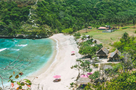 Beautiful idyllic white sand Atuh beach appealing for relax. Clear blue ocean waves rolling to the beach. Nusa Penida, Bali, Indonesiaの写真素材