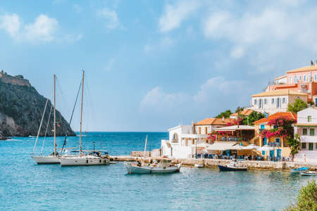 Holiday vacation in beautiful Assos village located in hidden cove on sunny summer day, Kefalonia...