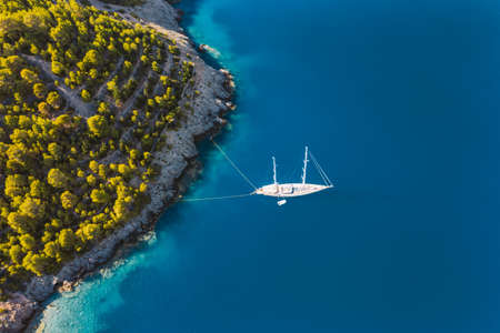 Aerial view of Luxury Sail Yacht in Assos village, Kefalonia Island, Greeceの写真素材