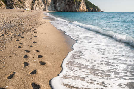 Foot steps on Milos beach near the Agios Nikitas village on Lefkada Ionian island, Greeceの写真素材