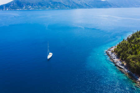 Sailing yacht boat in blue ionian see close to Fiscardo village. Kefalonia island, Greece. Travel summer conceptの写真素材