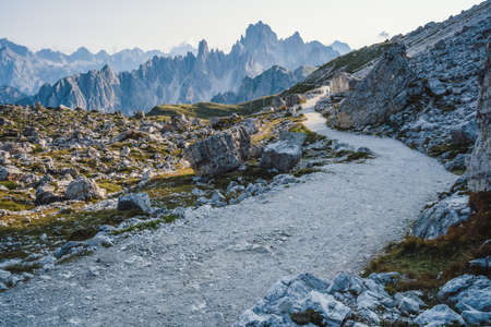 Hiking trail to Cime di Lavaredo with Cadini di Misurina mountain group in background. Dolomites, Italyの写真素材