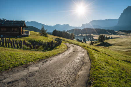 Morning landscape of Alpe di Siusi plateau road, Dolomites mountains, Italyの写真素材
