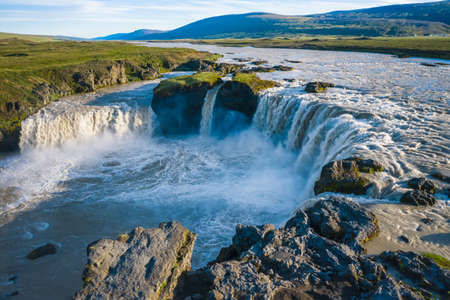 The aerial view of the beautiful waterfall of Godafoss after rainy days, Iceland in the summer seasonの写真素材