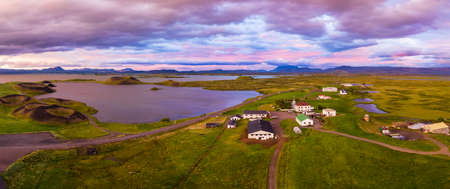 Aerial panoramic view of Myvatn, Iceland at epic sunset. Volcanic Craters In Green Plaints and link clouds and skyの写真素材
