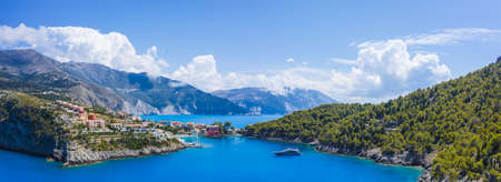 Assos picturesque fishing village from above, Kefalonia, Greece. erial drone view. Sailing boats...