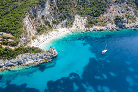 Aerial drone photo of iconic paradise sandy beach of Agiofili near port of Vasiliki with emerald crystal clear sea and sail boats docked, Lefkada island, Ionian, Greeceの写真素材