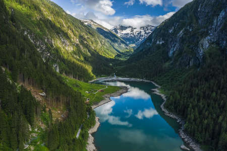 Aerial view of Gosau lake and Dachstein summit mountain range and visible glacier ice during summertime, Upper-Austria, Europeの写真素材