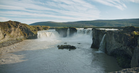 Beautiful cascade Godafoss waterfall in sunset scene, Icelandの写真素材