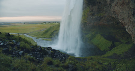 Close up of beautiful Seljalandfoss waterfall by sunset, Icelandの写真素材