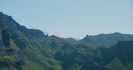 Masca Gorge. Volcanic green landscape of Tenerife, snowy peak of volcano Teide. Canary Islands, Spain.の写真素材