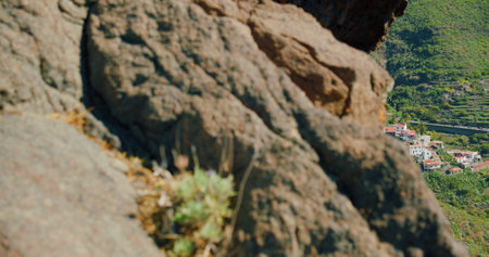 Masca Gorge or Barranco de Maska from the peak of the mountain peak. Tenerife. Rocky mountains in the foreground. Mirador La Cruz de Hilda. Spring.の写真素材
