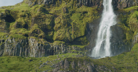 Beautiful waterfall cascade in eastern Iceland Bjarnarfoss Epic scene with Icelandic ladnscapeの写真素材