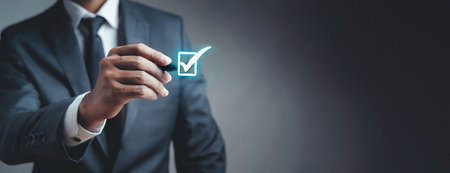 Businessman in suit marking a checklist icon in virtual space.の素材