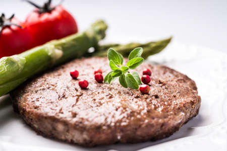 burger, basil, tomatoes and asparagus, pink pepper