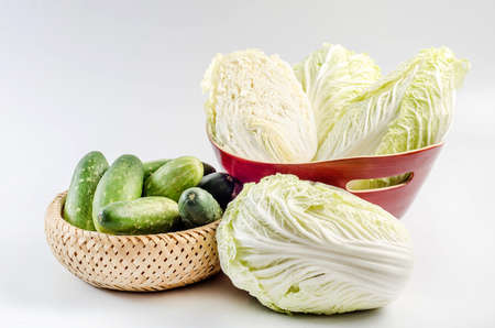 chard and cucumber in the basketの写真素材