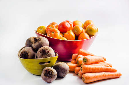 Tomato Basket, bowl Beet and carrotsの写真素材