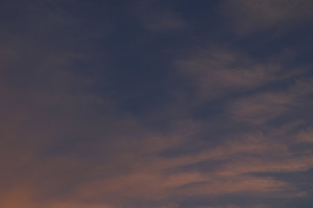 A Calm Yet Dramatic Blue and Orange Gradation Sky for A Beautiful Eveningの写真素材
