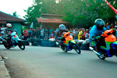 Motorcycle racing on dangerous cornersの写真素材