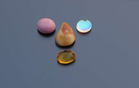 various agate on black glass mirrorの写真素材