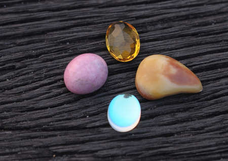 various agate on black ironwood