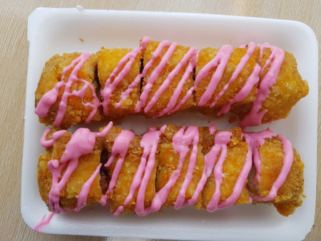 dessert, Selective focus Banana Grill with strawberry and cheesee garnish called pisang bakar keju. Served on white plate.の写真素材