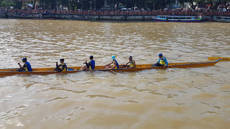 Unidentified rowers in traditional Thai long boats compete during King's Cup Traditional Long Boat...