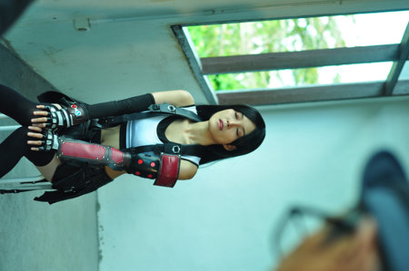 Portrait of a beautiful young woman in sportswear posing on the street
