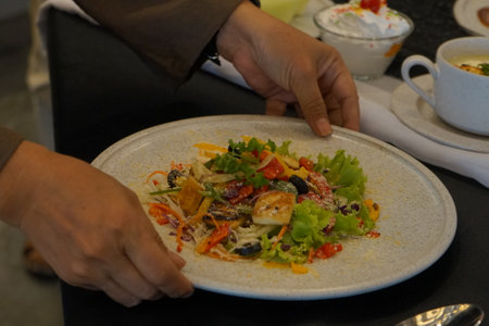 chef serving salad in a restaurant, food and drink concept.の写真素材