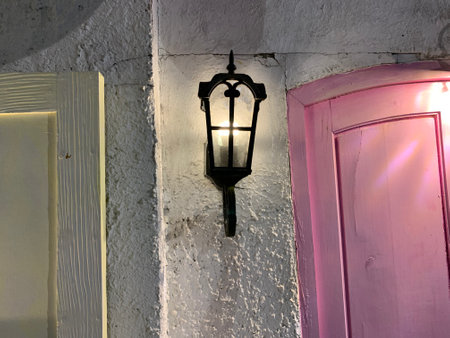 Lantern on the wall of an old house in Lisbon, Portugal