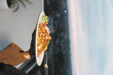 Woman holding a plate with a salad in her hands. Selective focus.の写真素材