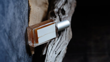 Perfume bottle on a wooden background. Shallow depth of fieldの写真素材