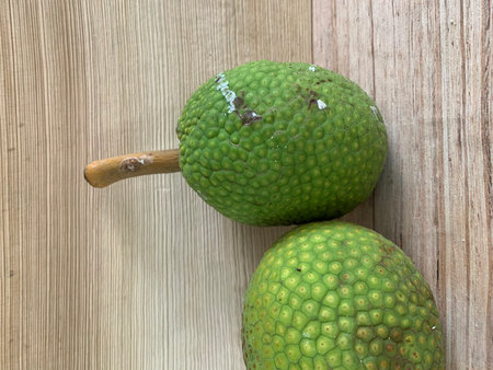 Jackfruit on wooden background, close up of fruit, Thailand.