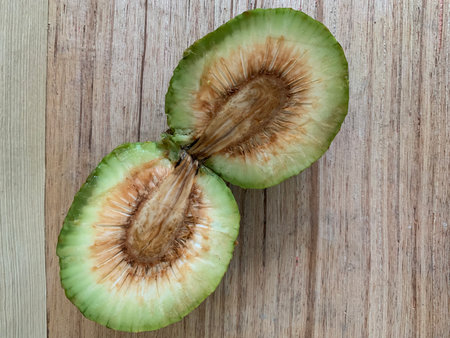 Sliced green melon on a wooden table, stock photo
