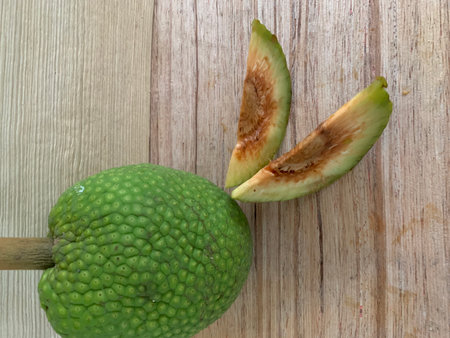 Sugar apple on wooden table, closeup of green sugar apple