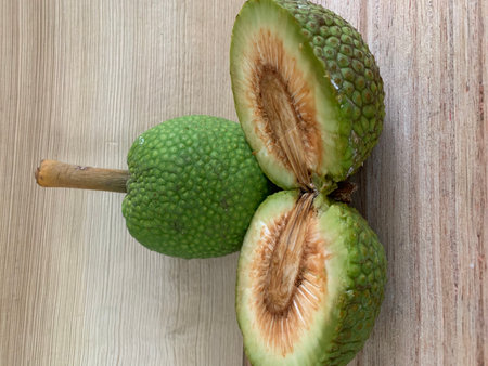 Close up of green fruit on wooden table background.