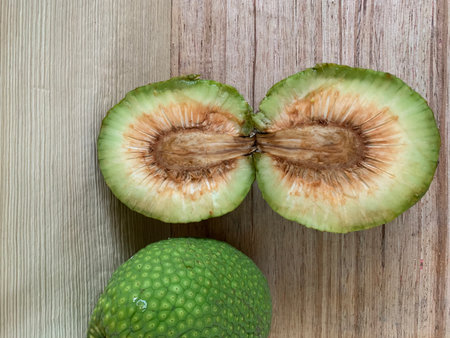 Close up view of green guava fruit on the wooden table.