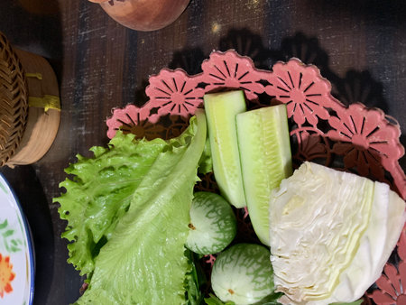 Cucumber, cucumber, lettuce and radish on wooden table.の写真素材