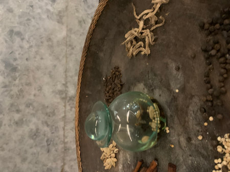 Coffee beans in a glass jar on a wooden table.の写真素材