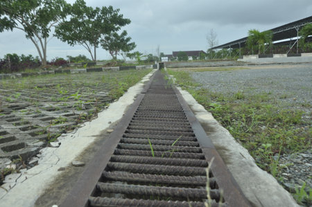 old rusty steel rails on the ground in the countryside of Thailand.の写真素材