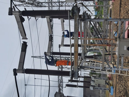 Electrician working on high voltage power line in Bangkok, Thailand.