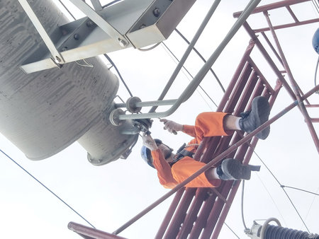 Technicians working in high voltage electricity pylon. Electricity pylon.