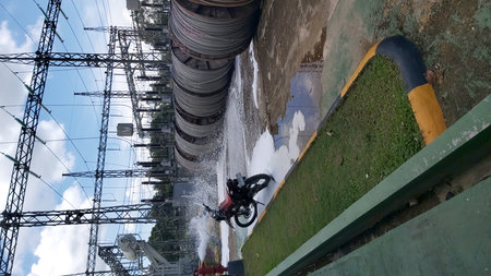 Mountain biker splashing water on the top of a building