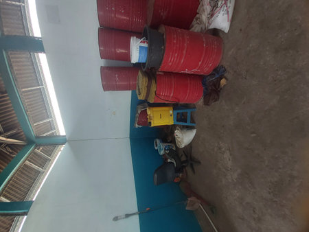 Workers are painting the ceiling of the building in the construction site.