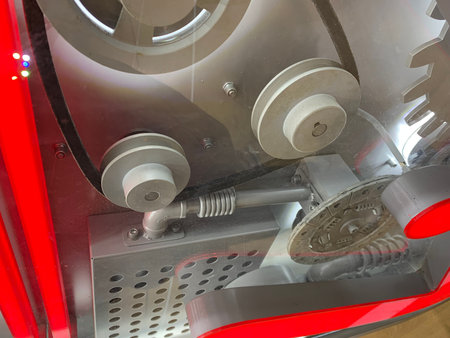 Cogwheels and gears in a machine, closeup of photo