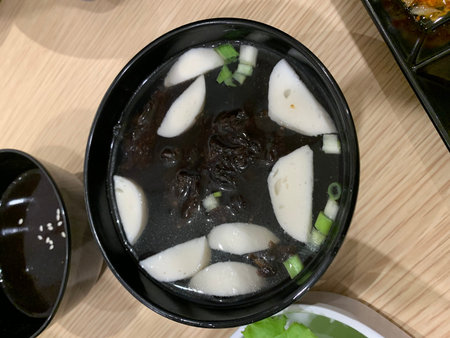 Korean food, simmered rice vermicelli in black bowl